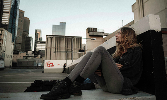 girl sitting on ground