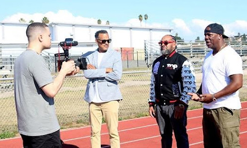 ppl standing on football field